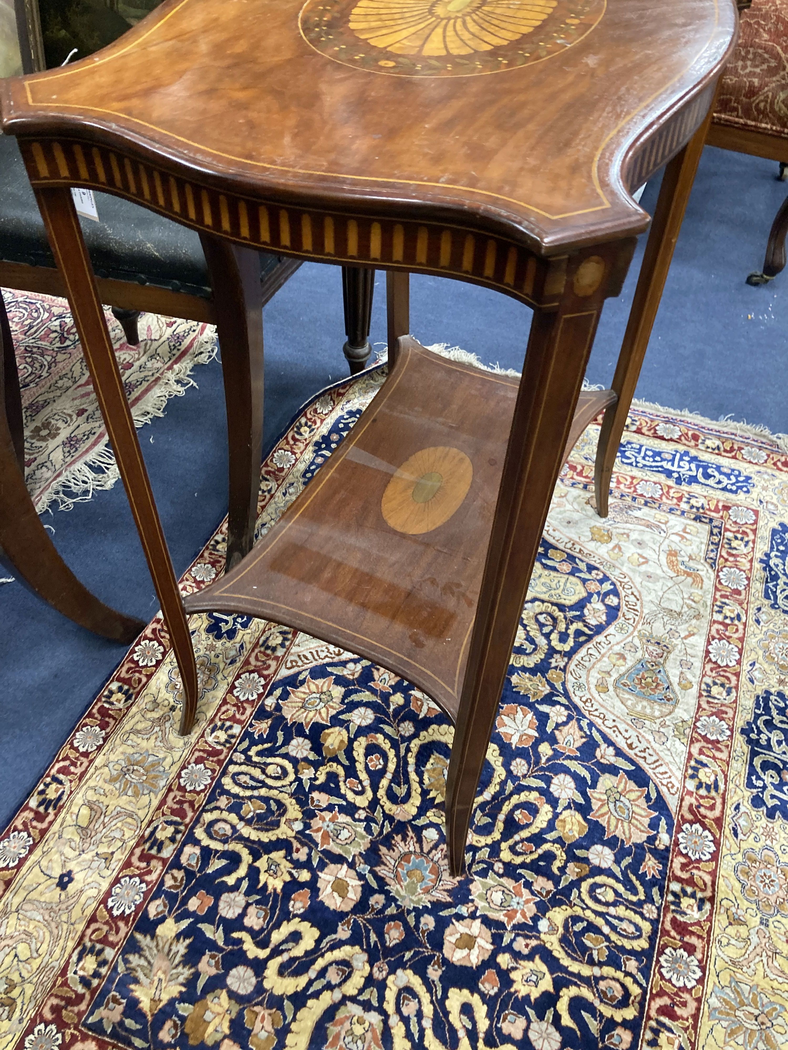 An Edwardian satinwood inlaid mahogany two tier occasional table, in Sheraton style, width 64cm, depth 40cm, height 74cm